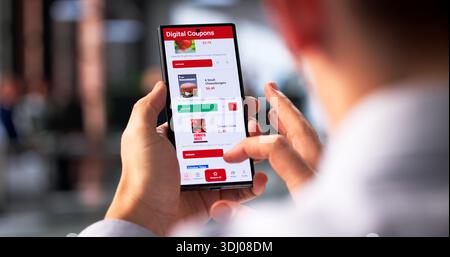 Hispanic Man Saving Money: Using Smartphone To Shop Online Stock Photo