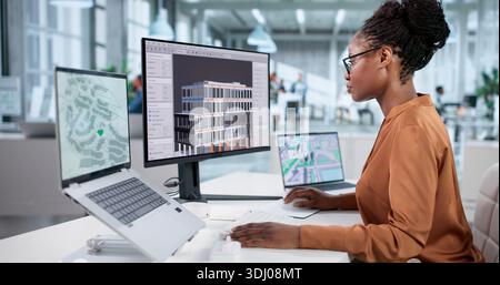 Virtual Construction Site: African American Woman Using 3D BIM Model Stock Photo