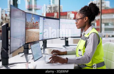 Young Female Engineer Uses 3D CAD Software To Check Industrial Systems. Stock Photo