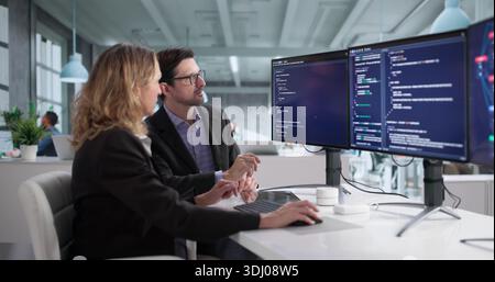 Team Of Programmers In Office Developing Cybersecurity Software Program Stock Photo