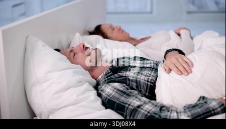 Peaceful Slumber For Elderly Couple In Comfortable Memory Foam Bed. Stock Photo