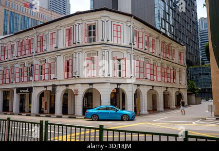 Wework shared office spaces at South Bridge Street traditional shophouses with a vibrant red and white colour scheme Stock Photo