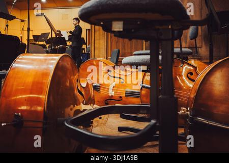 Symphonic double bass on the floor of the big stage of the concert hall. Stock Photo