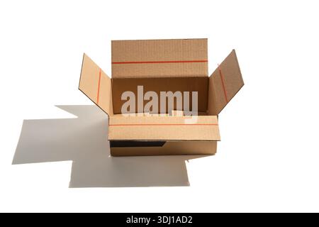 Open cardboard box photographed from a slightly lower top angle on white. Clean studio lighting emphasizes structure and depth for logistics or packag Stock Photo
