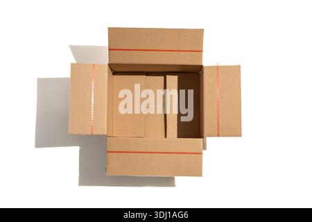 Top-down view of an open cardboard box with visible flaps. Minimalist packaging image ideal for shipping, storage, or e-commerce concepts. Stock Photo
