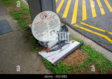 Do not feed the pigeon sign in Singapore Little India area Asia to discourage the spread of diseases. Residents can be fines if caught. Stock Photo