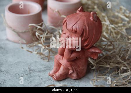Making and casting decorative candlesticks from plaster for home decoration in the workshop. Stock Photo