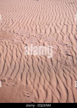 Sand shapes left by retreating tide on the beach at Red Point, Scotland Stock Photo