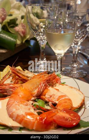 Elegant Seafood Platter With Giant Prawns And Greens At Formal Table Setting During Dinner Event Stock Photo
