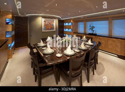 Luxurious Dining Table Set For Formal Dinner In An Elegant Yacht Dining Room Stock Photo