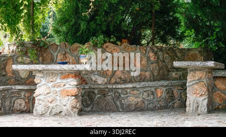 Stone Bench Sanctuary in the Garden Shade Stock Photo