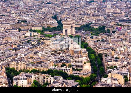 Arc de Triomphe in Paris viewed from the Eiffel Tower, showing Champs Elysees and classic Haussmann architecture cityscape. Stock Photo