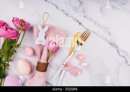 Elegant Easter Table Composition with Roses and Cutlery Stock Photo