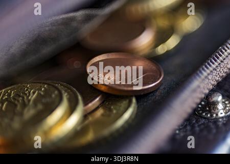 Coins of various sizes in an opened leather pouch, Finances, Cologne, North Rhine-Westphalia, Germany Stock Photo