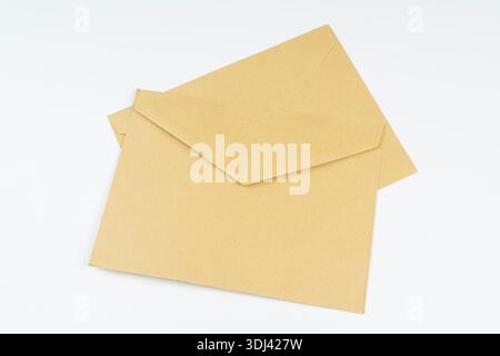 two yellow envelopes  on a white surface Stock Photo