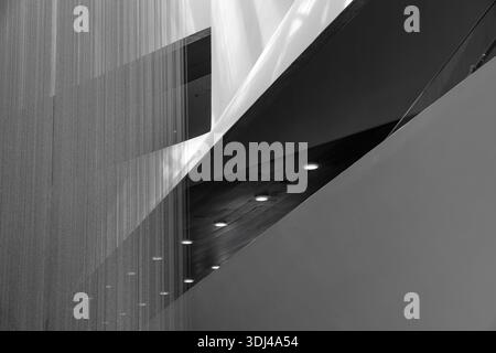 Abstract Black and White Architectural Interior Featuring Geometric Curves and Vertical Textured Lines. Stock Photo