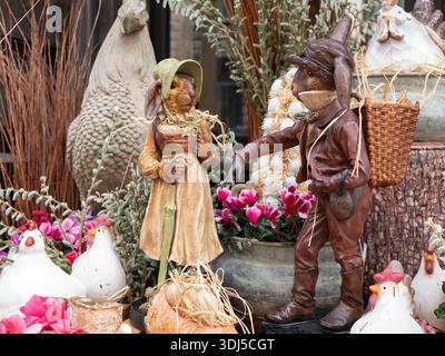 Yerevan, Armenia - 27 March 2023: Charming Easter composition featuring bunny figurines. Delightful arrangement of spring flowers and festive decorati Stock Photo