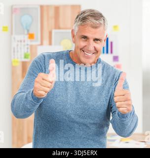Corkboard is displaying pinned charts and lightbulb sketch in bright office with scattered papers. Minimalist, man, professional, planning, brainstorm Stock Photo