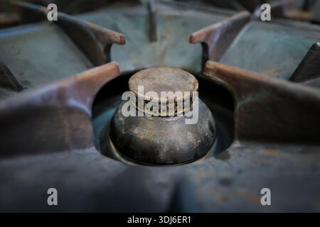 Details with the professional gas burner inside a restaurant kitchen. Stock Photo