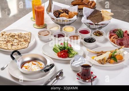Traditional Turkish breakfast table with various dishes and tea Stock Photo