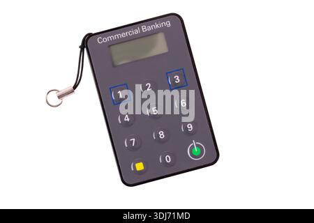Digital security banking keycard with a keypad and digital display on a white isolated background. Used for remote secure access to online data Stock Photo