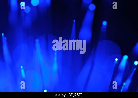 Blue fiber optic glowing strands, abstract technological background. Data transfer, connectivity, future tech, network Stock Photo