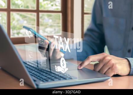 Tax return calculation concept financial research government tax businessman using laptop filling out income tax form online for payment Stock Photo