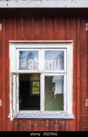 Open window on an old deserted cottage Stock Photo