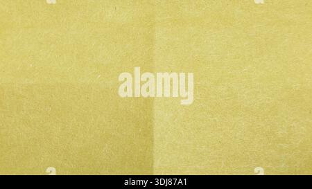 High resolution macro texture of brown recycled fiber paper background with natural grain Stock Photo