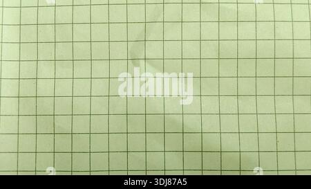 Yellow grid paper background texture on a fibrous recycled paper surface for a vintage look Stock Photo