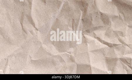 High quality textured background of old crumpled brown kraft paper with wrinkles and creases Stock Photo