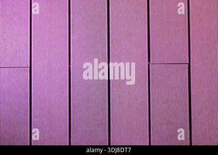 Vertical wooden texture in pink  magenta tones creating a modern creative background. Stock Photo
