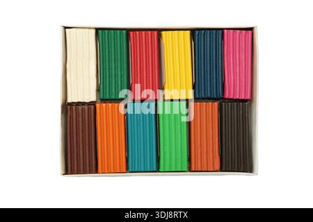 Multi-colored plasticine bricks isolated on white background. Childrens plasticine close-up. Top view Stock Photo