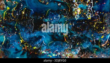 Blur glitter liquid. Sparkling background. Golden colorful particles spill in blue turquoise fluid. Curl color spangle stream abstract emulsion. Stock Photo