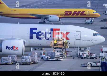 FedEx Express Boeing 777-FS2 cargo plane is unloaded, air freight
