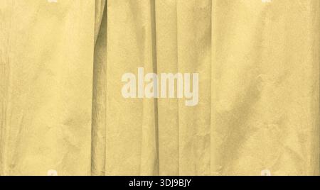 Detailed close up of folded crepe paper texture in yellow color, abstract pattern background for creative design, craft projects, gift wrapping, artis Stock Photo