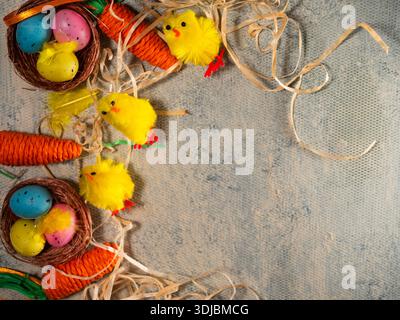 Easter display with eggs chicks and carrots with straw  Stock Photo
