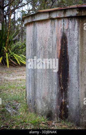Close-up detail of weathered concrete water tank surface with stains and marks, rural infrastructure in New South Wales, Australia. Stock Photo