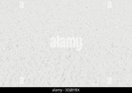 Top view of white snow background. Winter wallpaper, Christmas, Happy New Year. Copy space, flat lay. Stock Photo