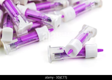 Disposable safety lancets. Automatic lancet scarifier for painless blood sampling. Blood test with a finger. injection of blood. Stock Photo