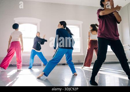 Group of women rehearsing contemporary dance in studio Stock Photo