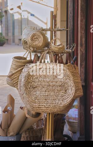 Handmade wicker baskets on a city street. Stock Photo