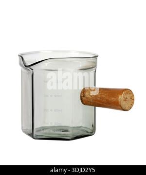 Glass espresso measuring cup with wooden handle and markings isolated on white background, barista coffee equipment Stock Photo