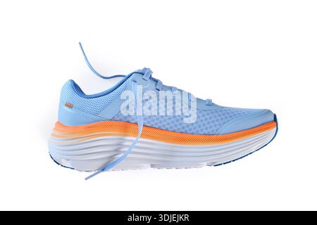 Pale blue and orange running shoe isolated on a white background Stock Photo