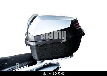 Motorcycle top case storage box mounted on rear rack. Hard plastic luggage for helmet and gear isolated on white background. Stock Photo