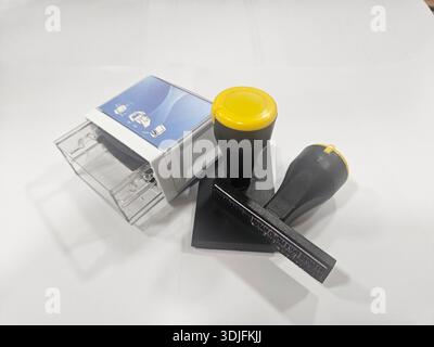 Essential Office Fasteners on White Surface. Stock Photo