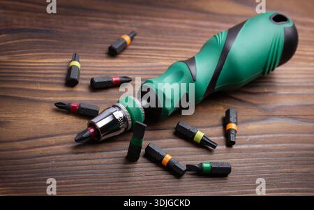 Screwdriver tips different shapes and sizes. Manual screwdriver and set of the interchangeable bits. Precision Screwdriver Kit. Steel Precision Magnet Stock Photo