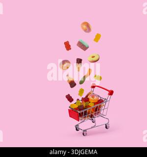 falling jelly beans into a shopping cart, representing a sweet treat purchase. Stock Photo