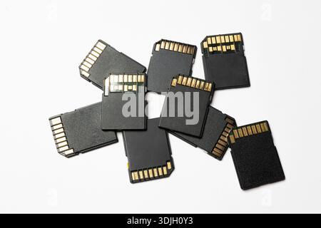 some SD cards on a white surface Stock Photo