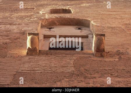 View of the ancient brickwork, with an alcove and stone supports, revealing textures and shadows in the historic architecture, Granada, Andalusia, Spa Stock Photo